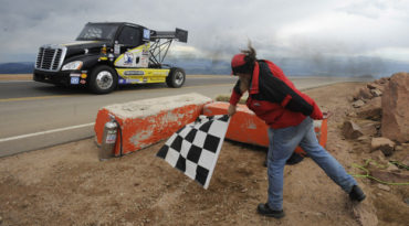Mike Ryan drives over the finish line in his big rig in the exhibition division at the Pikes Peak International Hill Climb on Sunday, June 27, 2010. He won the unlimited division. (The Gazette/Jerilee Bennett)